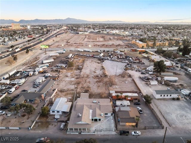 birds eye view of property featuring a mountain view