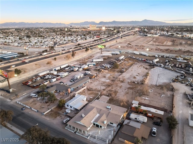 birds eye view of property with a mountain view