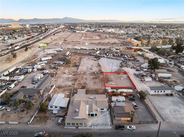 birds eye view of property with a mountain view