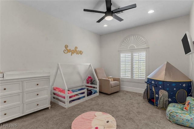 interior space with ceiling fan and light carpet