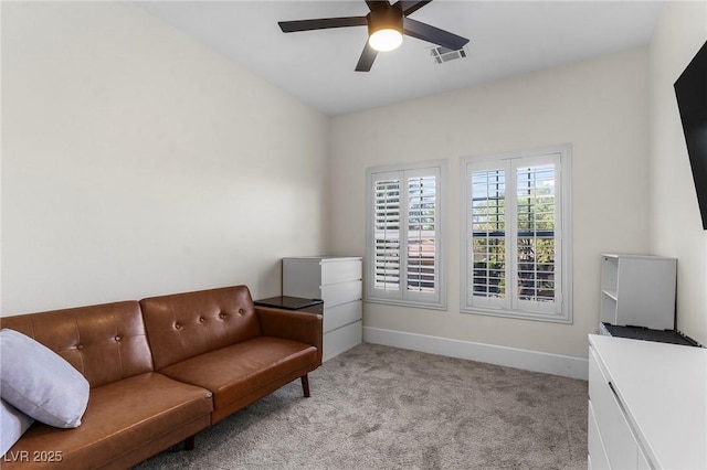 sitting room with light colored carpet and ceiling fan