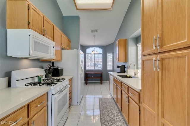 kitchen featuring sink, white appliances, a notable chandelier, light tile patterned flooring, and decorative light fixtures