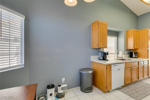 kitchen with sink, light tile patterned floors, and dishwasher