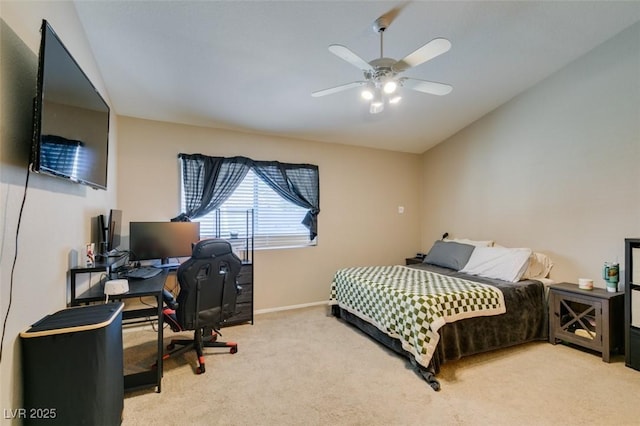 bedroom featuring lofted ceiling, light carpet, and ceiling fan