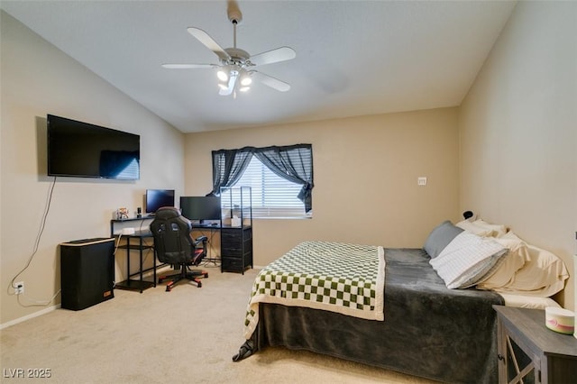 carpeted bedroom with vaulted ceiling and ceiling fan