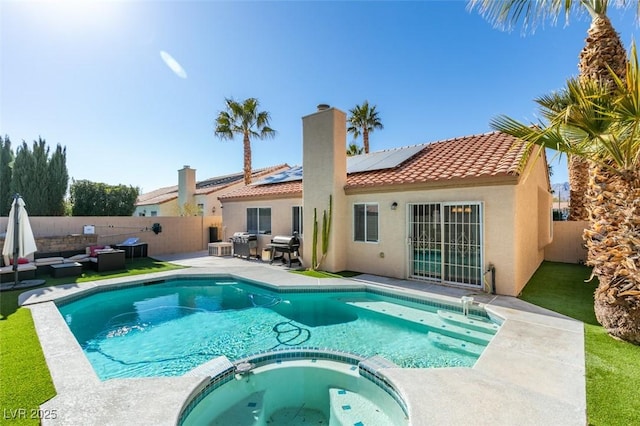 view of swimming pool with an outdoor living space, an in ground hot tub, area for grilling, and a patio area