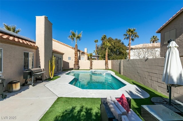 view of swimming pool with a grill and a patio