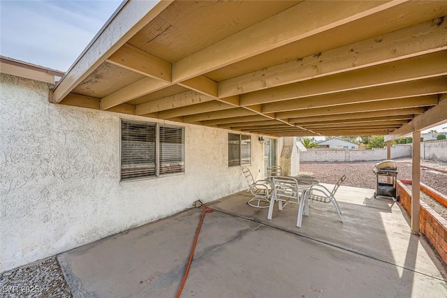 view of patio featuring a grill