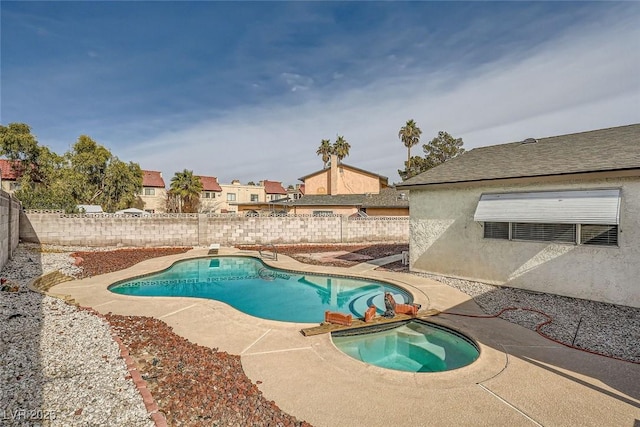 view of pool with an in ground hot tub and a patio