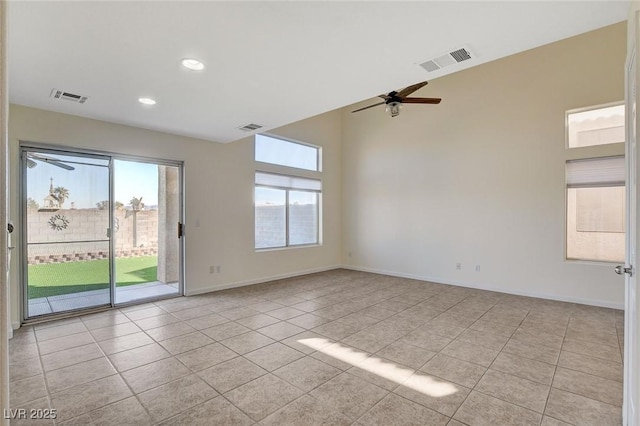 empty room with light tile patterned floors and ceiling fan