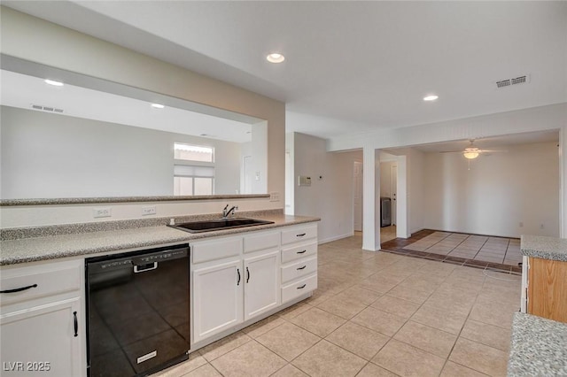 kitchen with light tile patterned flooring, sink, white cabinetry, black dishwasher, and ceiling fan