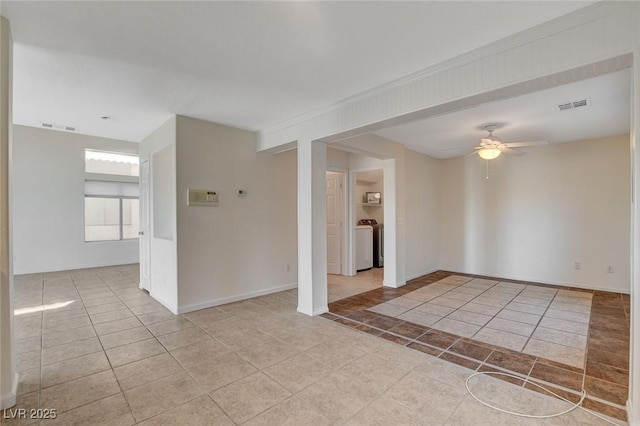 tiled spare room featuring ceiling fan