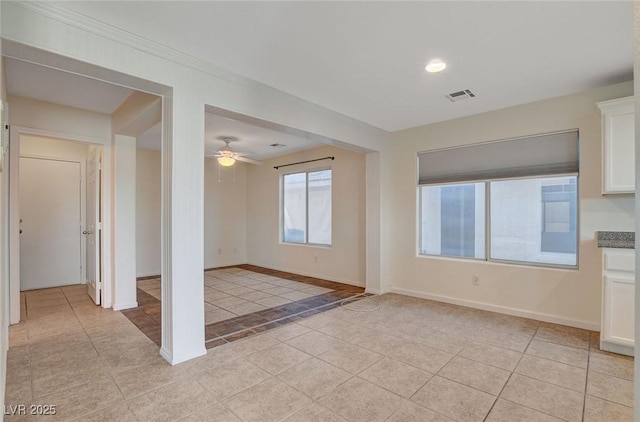 interior space featuring ceiling fan and light tile patterned floors