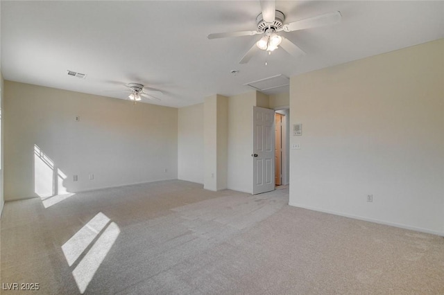 carpeted empty room featuring ceiling fan