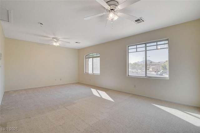 empty room with light carpet and ceiling fan