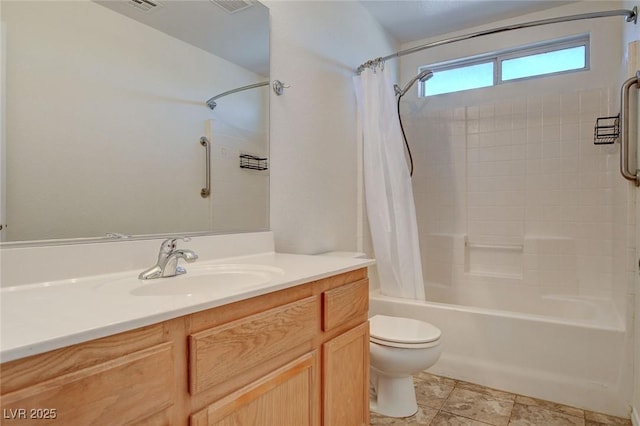 full bathroom featuring vanity, toilet, and shower / tub combo