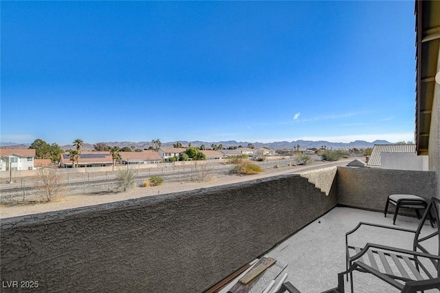 balcony featuring a mountain view