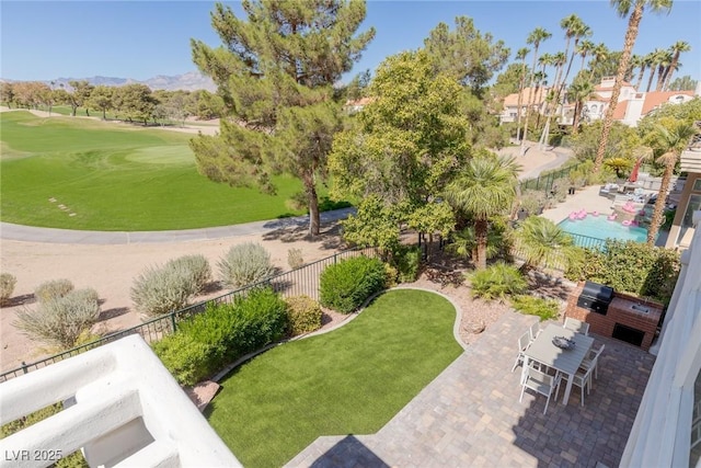 view of home's community with a yard and a patio area