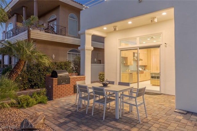 view of patio with a balcony and area for grilling