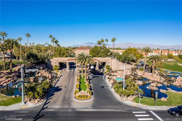 birds eye view of property with a mountain view