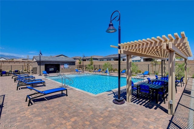 view of swimming pool with a pergola and a patio