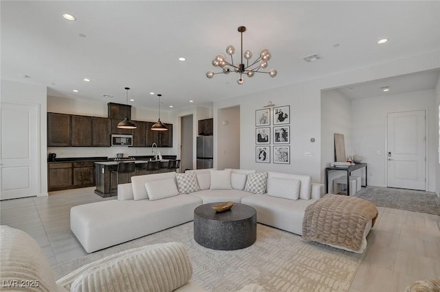 living room with a notable chandelier