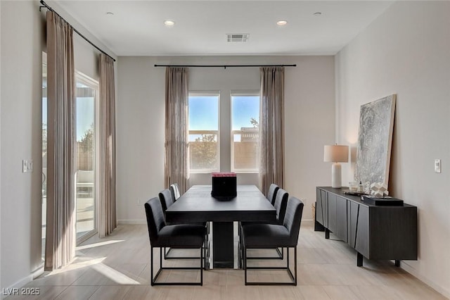 dining space with light tile patterned flooring