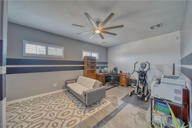 home office featuring ceiling fan and a textured ceiling