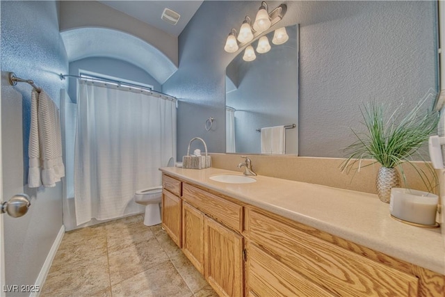 full bathroom featuring shower / bath combination with curtain, vanity, and toilet