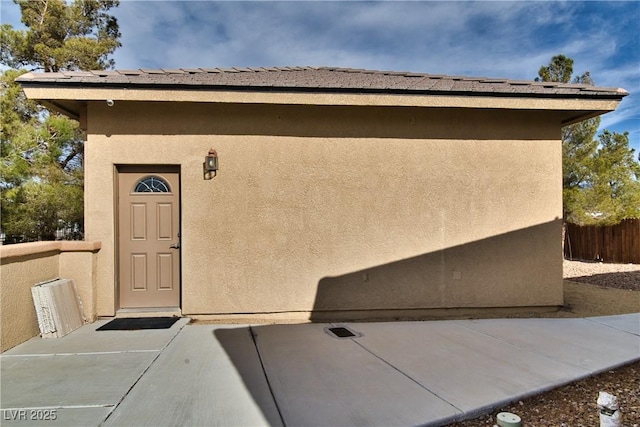 property entrance featuring a patio