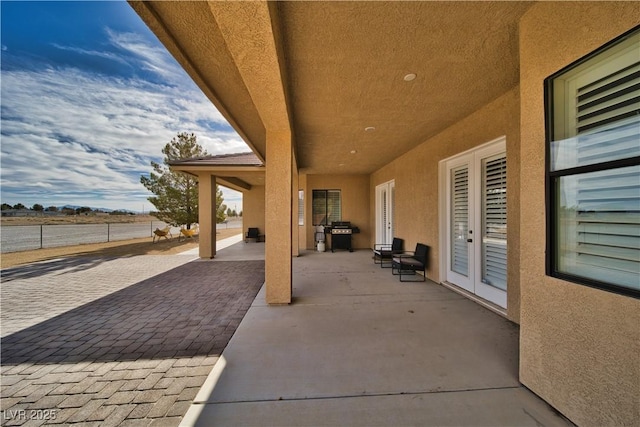 view of patio featuring a grill and french doors