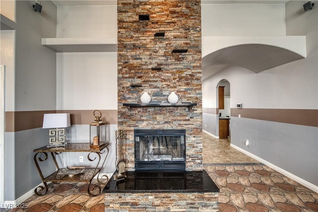 unfurnished living room featuring a fireplace