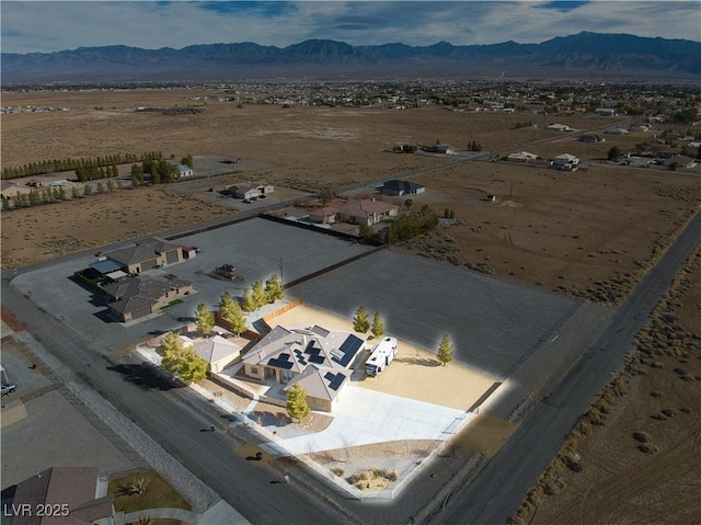 drone / aerial view featuring a mountain view