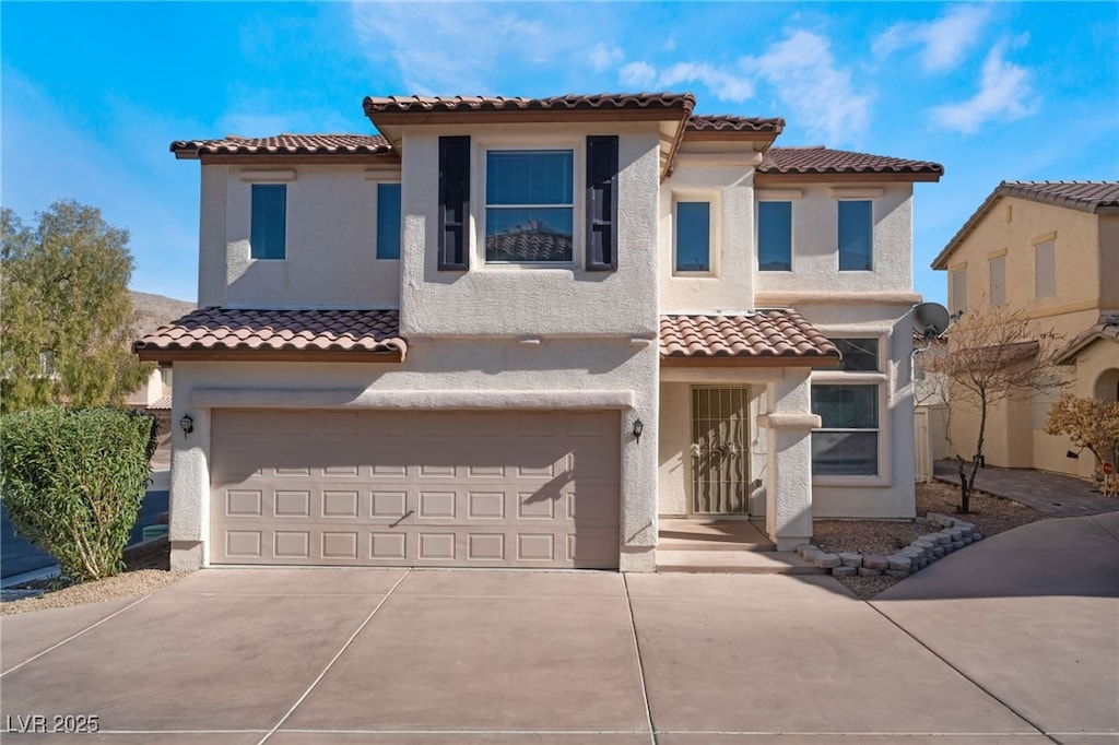 mediterranean / spanish-style house featuring a garage