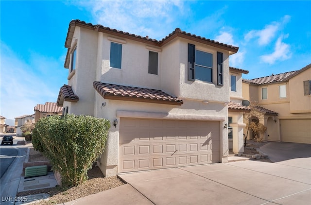 mediterranean / spanish-style house featuring a garage