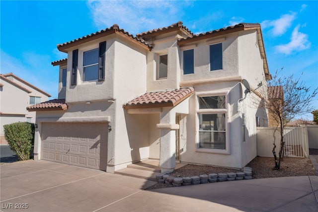 mediterranean / spanish-style house featuring a garage