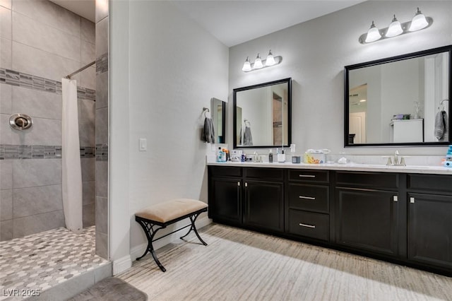 bathroom featuring vanity and a shower with shower curtain