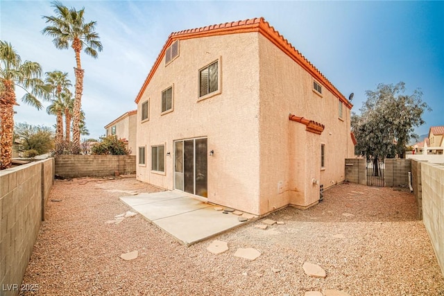 rear view of house featuring a patio