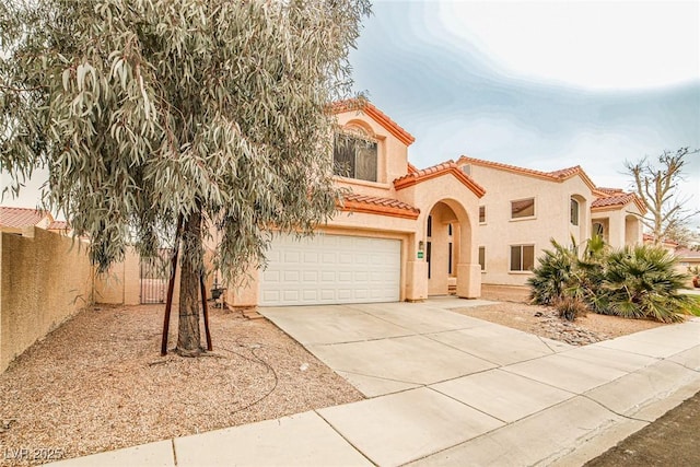 mediterranean / spanish-style house featuring a garage