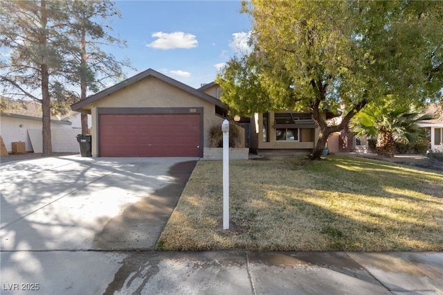 view of front of home featuring a garage and a front yard