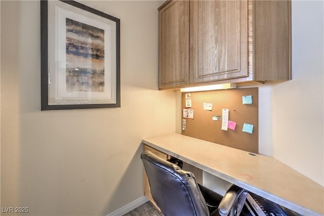 office area with built in desk
