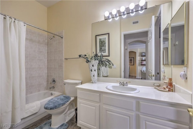 full bathroom featuring vanity, toilet, and shower / bath combo with shower curtain