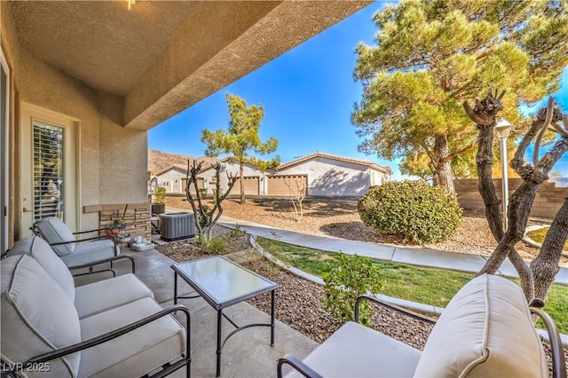 view of patio / terrace featuring outdoor lounge area and central air condition unit