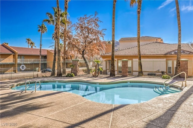 view of swimming pool featuring a patio area