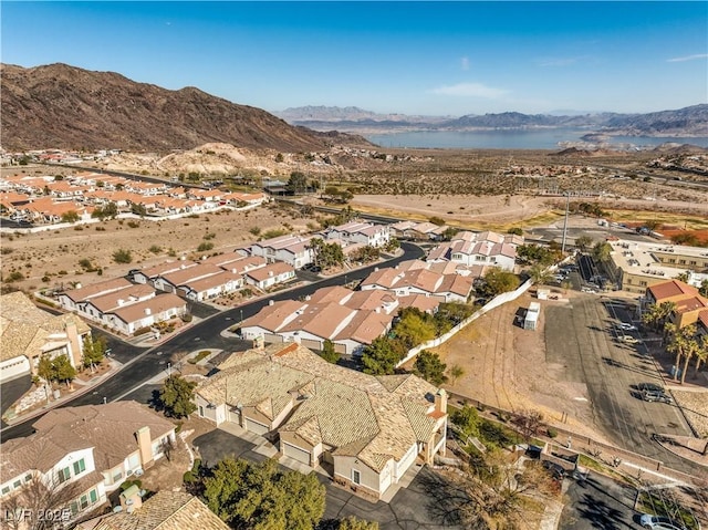 birds eye view of property featuring a water and mountain view
