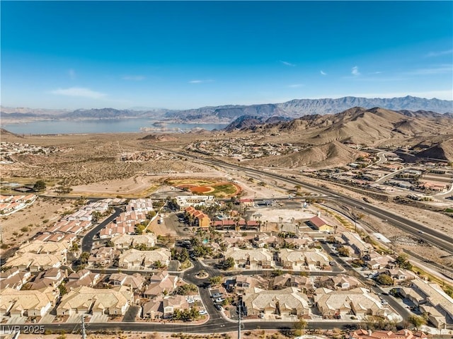 birds eye view of property with a mountain view