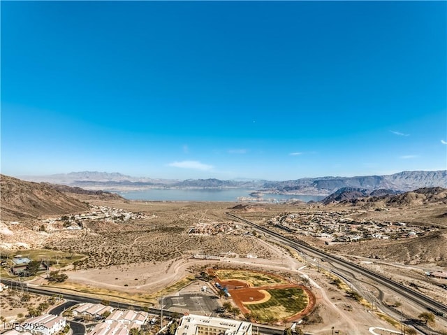 aerial view featuring a water and mountain view