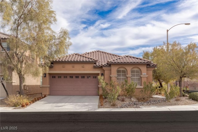 mediterranean / spanish-style home featuring a garage