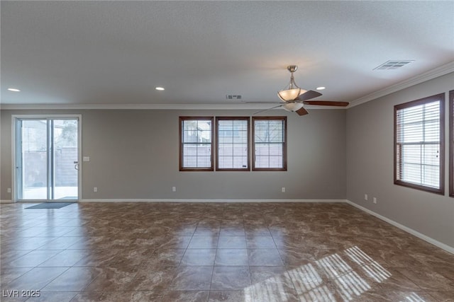 unfurnished room with crown molding, ceiling fan, plenty of natural light, and dark tile patterned flooring