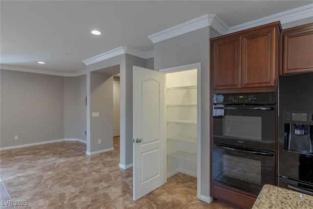 kitchen with ornamental molding, light stone countertops, and black appliances